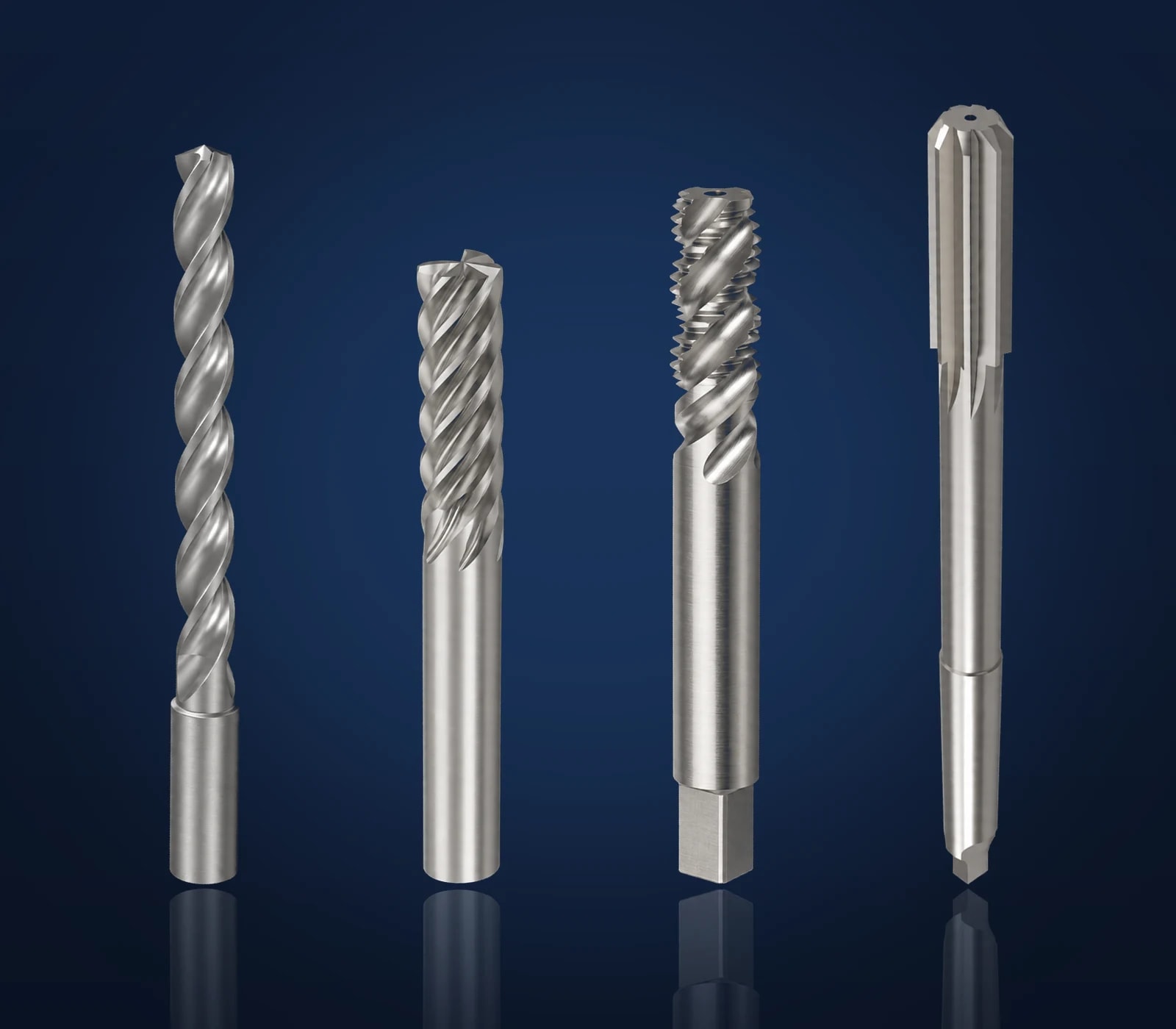 Bauron drill, end mill, tap and reamer lined up side by side