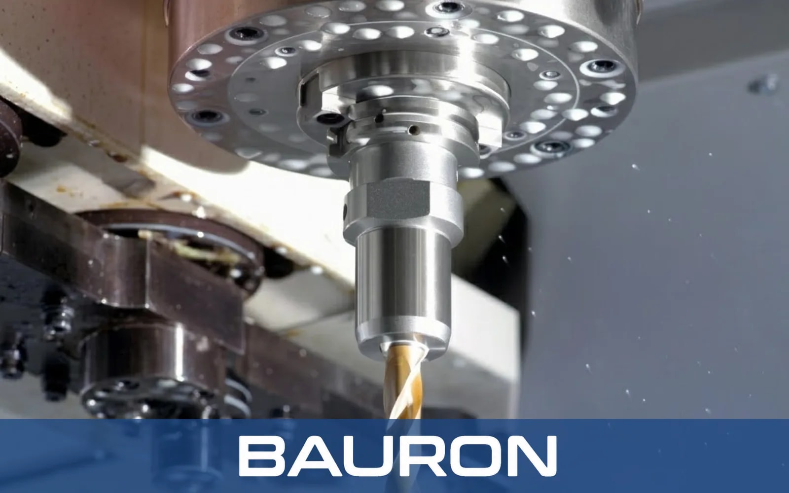 Coated drill cutting in the spindle of a CNC machining center