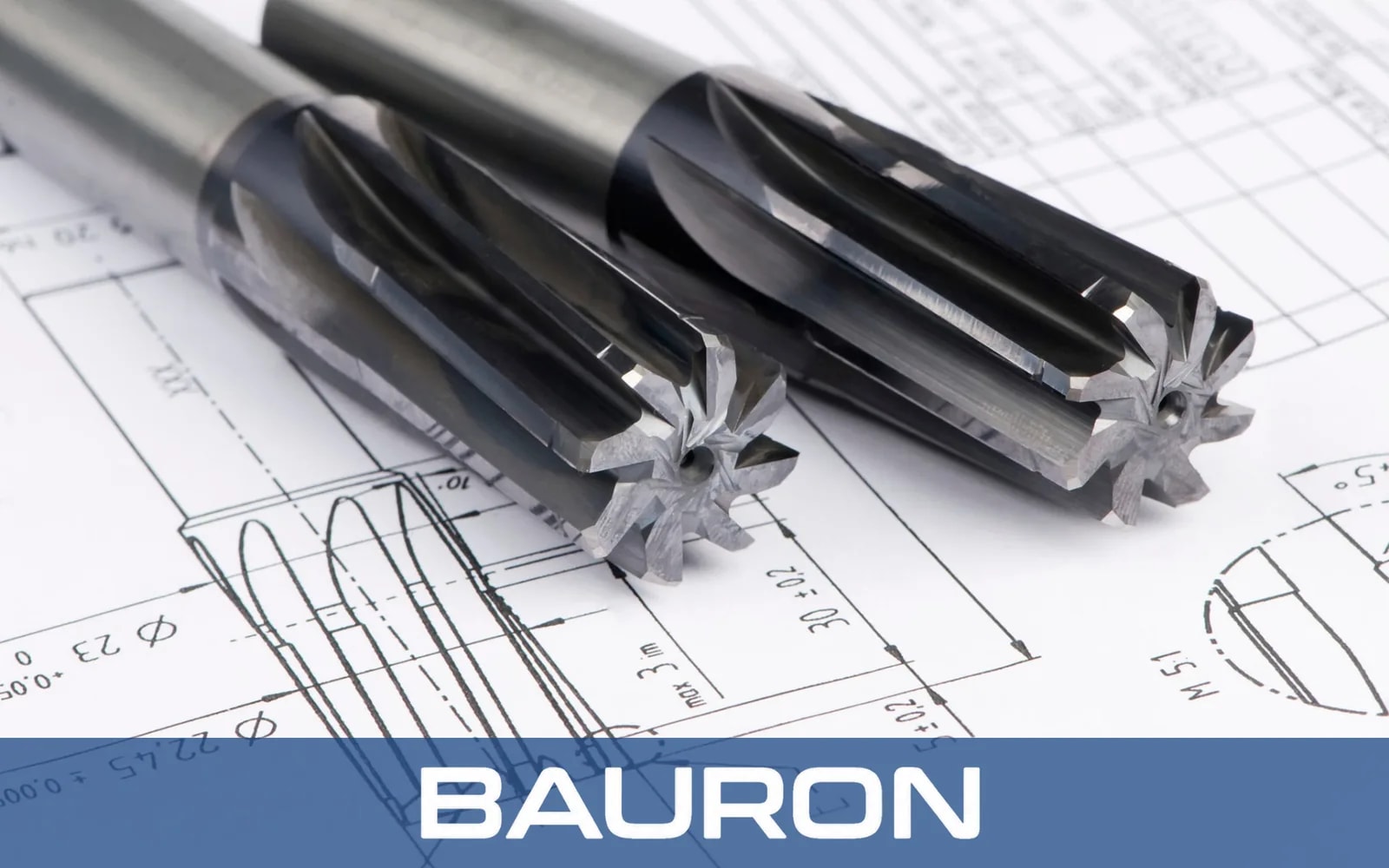 Carbide reamers resting on a technical drawing