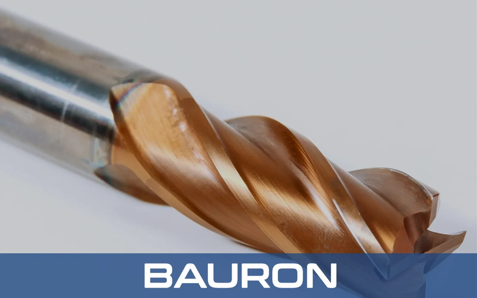 Close-up of a bronze-coated carbide end mill